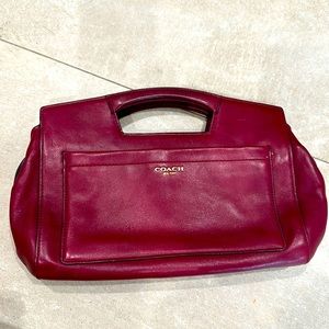 Vintage Coach maroon clutch with top zipper closure